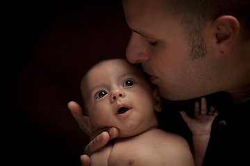 Image showing Young Father Holding His Mixed Race Newborn Baby