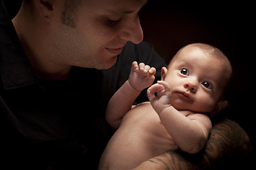 Image showing Young Father Holding His Mixed Race Newborn Baby