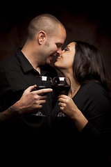 Image showing Happy Mixed Race Couple Holding Wine Glasses