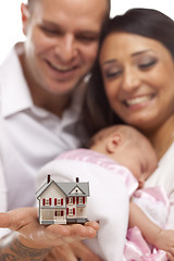 Image showing Mixed Race Family with Small Model House