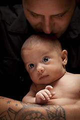 Image showing Young Father Holding His Mixed Race Newborn Baby