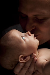 Image showing Young Father Holding His Mixed Race Newborn Baby