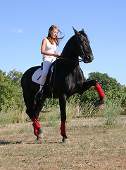 Image showing young woman and horse