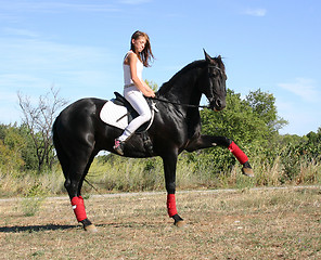 Image showing young woman and horse