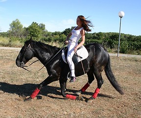 Image showing young woman and horse