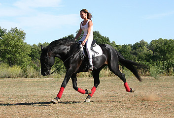 Image showing young woman and horse