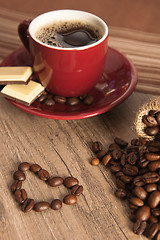 Image showing Grains of coffee on a wooden surface