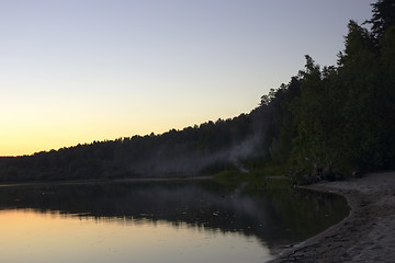 Image showing summer sunset and smoke under water