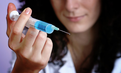 Image showing Portrait of a young doctor with syringa.