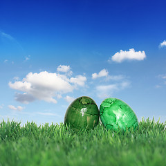 Image showing Green Easter eggs on a green meadow