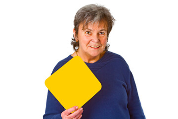 Image showing Female senior holding blank label