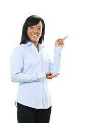 Image showing Smiling young woman pointing