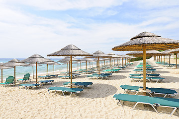Image showing Beach umbrellas on sandy seashore