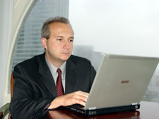 Image showing Businessman with laptop