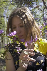 Image showing Young woman and flowers