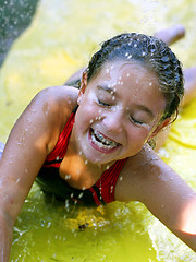 Image showing Happy girl playing with water