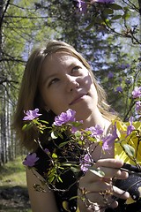 Image showing Young woman and flowers