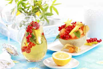 Image showing Fresh fruits served in melon bowl
