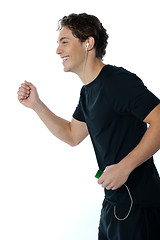 Image showing Handsome sports person enjoying music