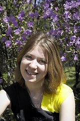 Image showing Young woman and flowers