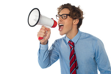 Image showing Young businessman using megaphone