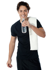 Image showing Fit man drinking water isolated on white