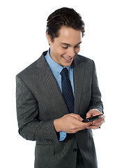 Image showing Happy businessman using a mobile phone
