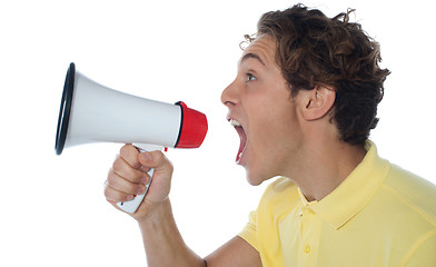 Image showing Young man with megaphone