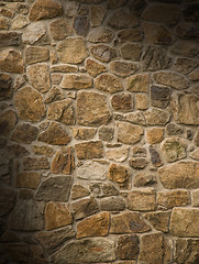 Image showing Masonry rock wall lit diagonally