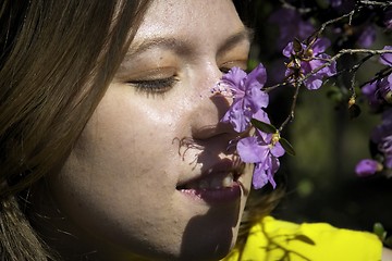 Image showing Young woman and flowers