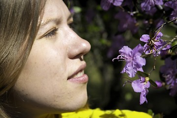 Image showing Young woman and flowers