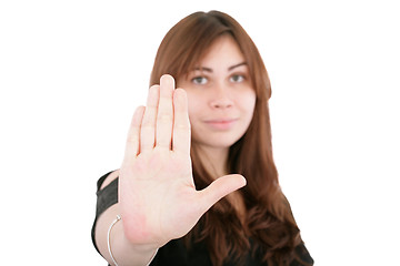 Image showing young woman making stop with his hand on white background 