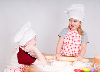 Image showing girl and boy  in chef's hats