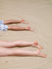 Image showing Legs on the beach