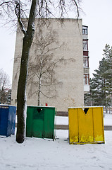 Image showing snow cover plastic bins for sort waste in winter 