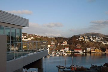 Image showing new modern architecture at frozen riverside in winter