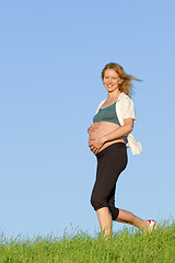 Image showing pregnant woman on meadow