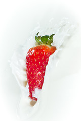 Image showing strawberry splashing into milk