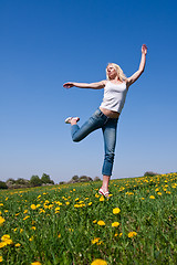 Image showing happy young woman on meadow