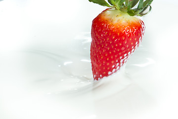 Image showing strawberry splashing into milk