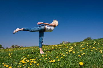 Image showing young woman exercising yoga