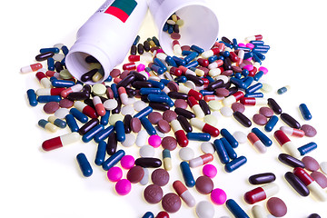 Image showing pills spilling out of container 