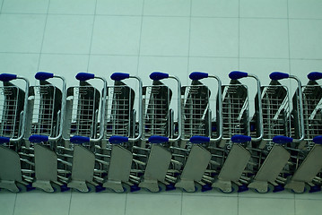 Image showing Baggage trolleys at an airport