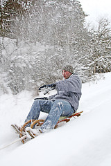 Image showing young man goes sleigh in winter