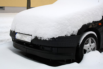 Image showing black car covered with snow
