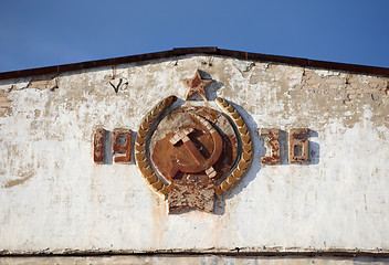 Image showing Coat of arms of the USSR on the facade of the old barracks