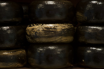 Image showing Nine big black Gouda cheese