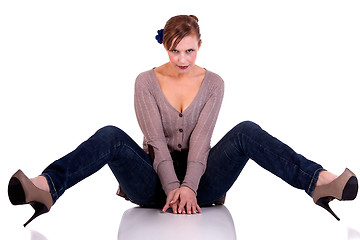 Image showing beautiful and happy middle-aged woman, sitting on the floor