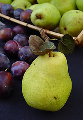 Image showing Green pears and italian plums