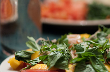 Image showing Green salad with mango and tomatoes